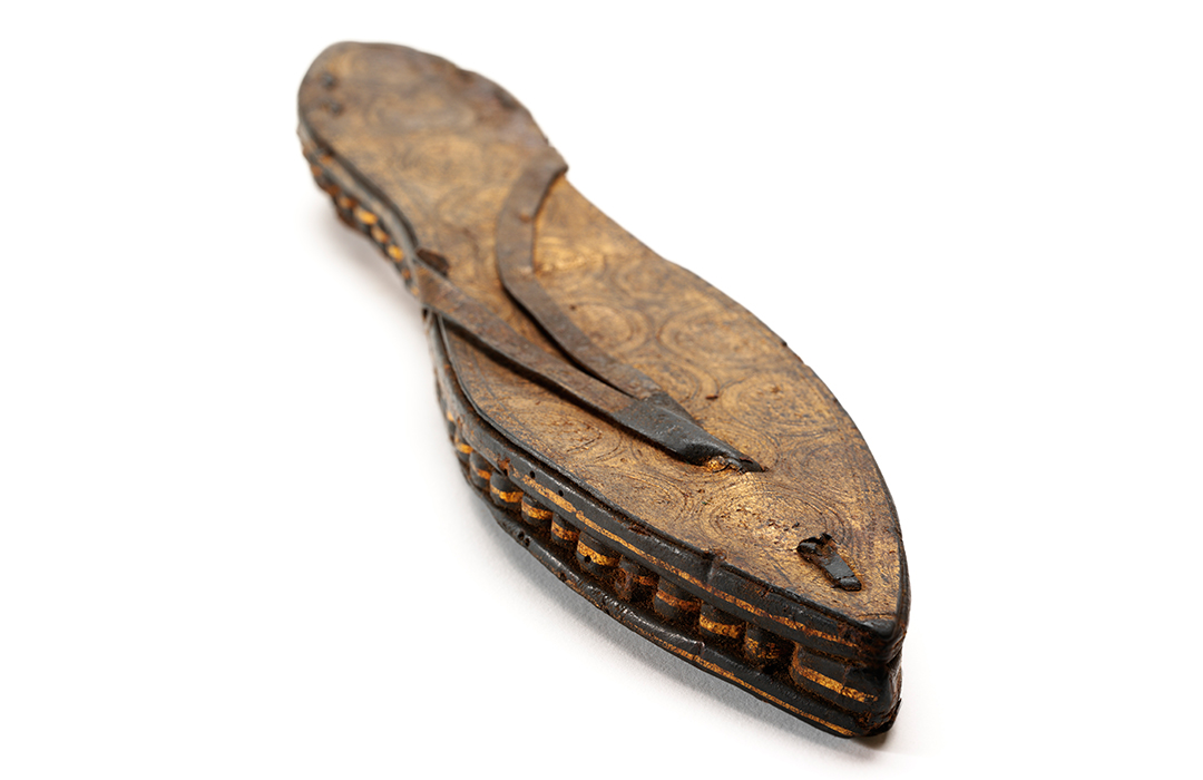 One sandal, gilded and incised leather and papyrus, Egypt, c 30 BCE-300 CE, photo courtesy of Victoria and Albert Museum, London.